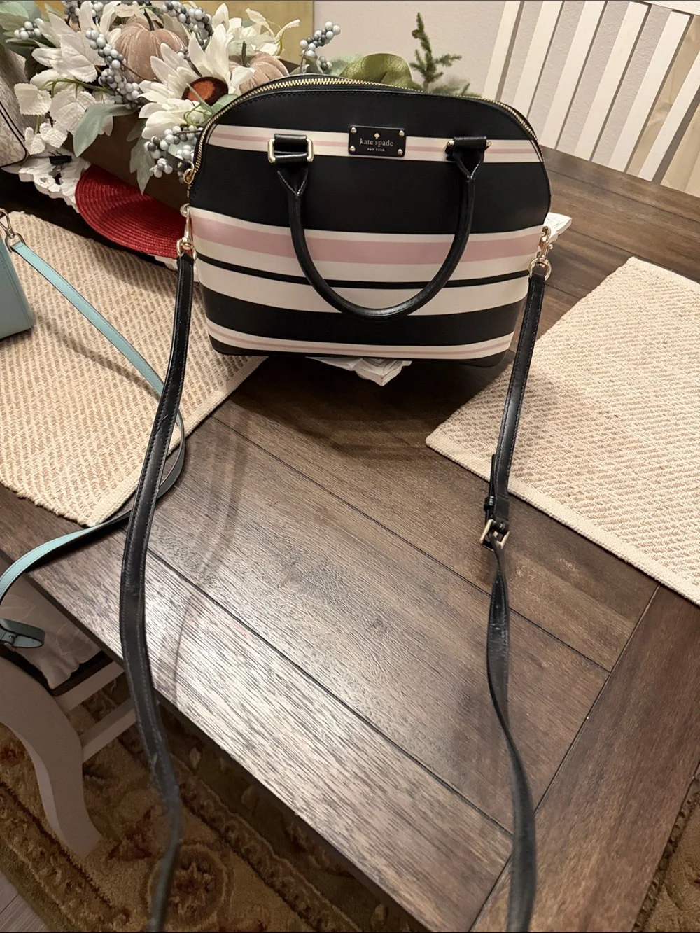 Kate Spade Grove Street Carli Satchel features a classic look